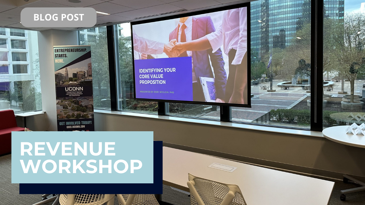 Workshop venue with sign and projector screen